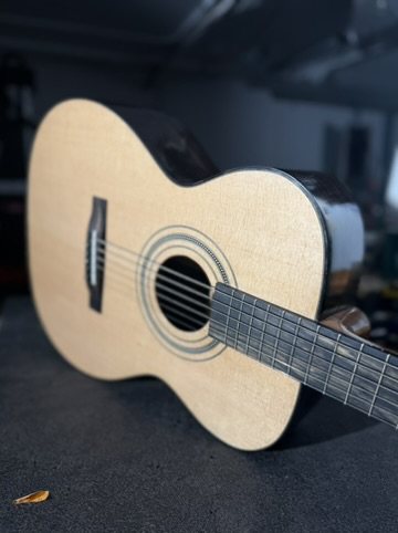 A finished Rick Molloy acoustic guitar.
