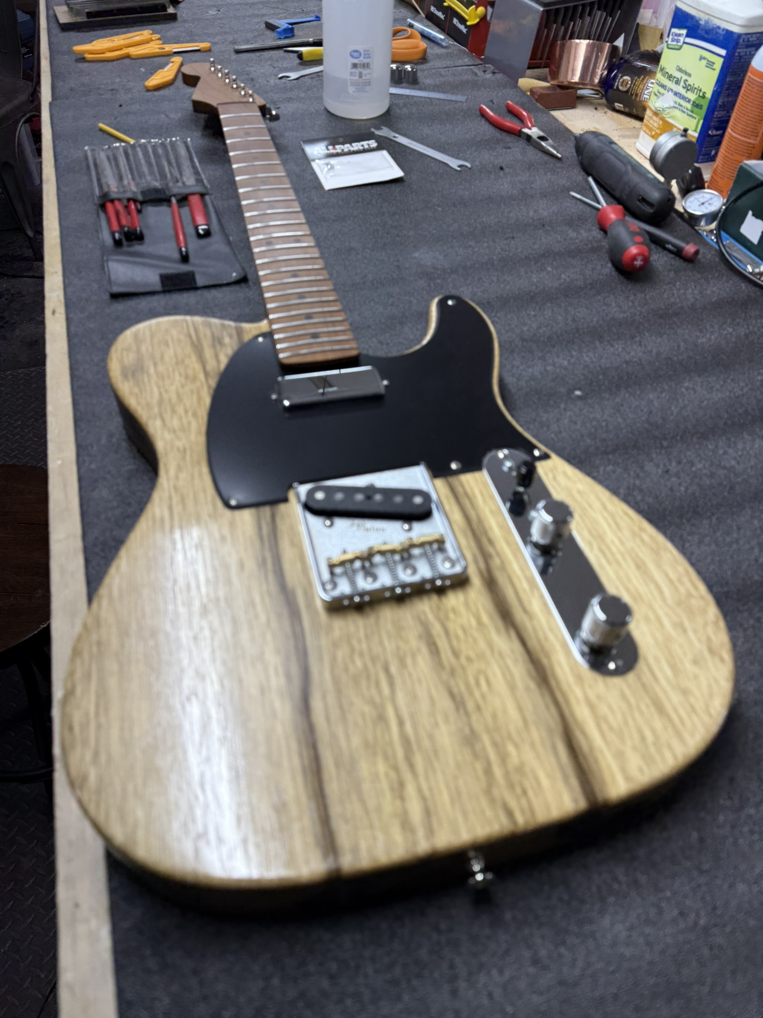 A partscaster on the bench during a workshop build.
